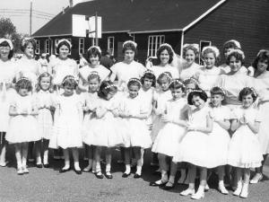 This gives you an idea of what May processions were like in the early 60s - and if you need to hear "Oh Mary, we crown thee with blossoms today ..." visit http://youtu.be/p_fln4An7G4.