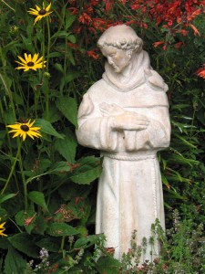 Many of the stories that surround the life of St. Francis deal with his love for animals. Perhaps the most famous incident that illustrates the Saint's humility towards nature is recounted in the "Fioretti" ("Little Flowers"), a collection of legends and folklore that sprang up after the Saint's death. It is said that, one day, while Francis was traveling with some companions, they happened upon a place in the road where birds filled the trees on either side. Francis told his companions to "wait for me while I go to preach to my sisters the birds." The birds surrounded him, intrigued by the power of his voice, and not one of them flew away. He is often portrayed with a bird, typically in his hand.